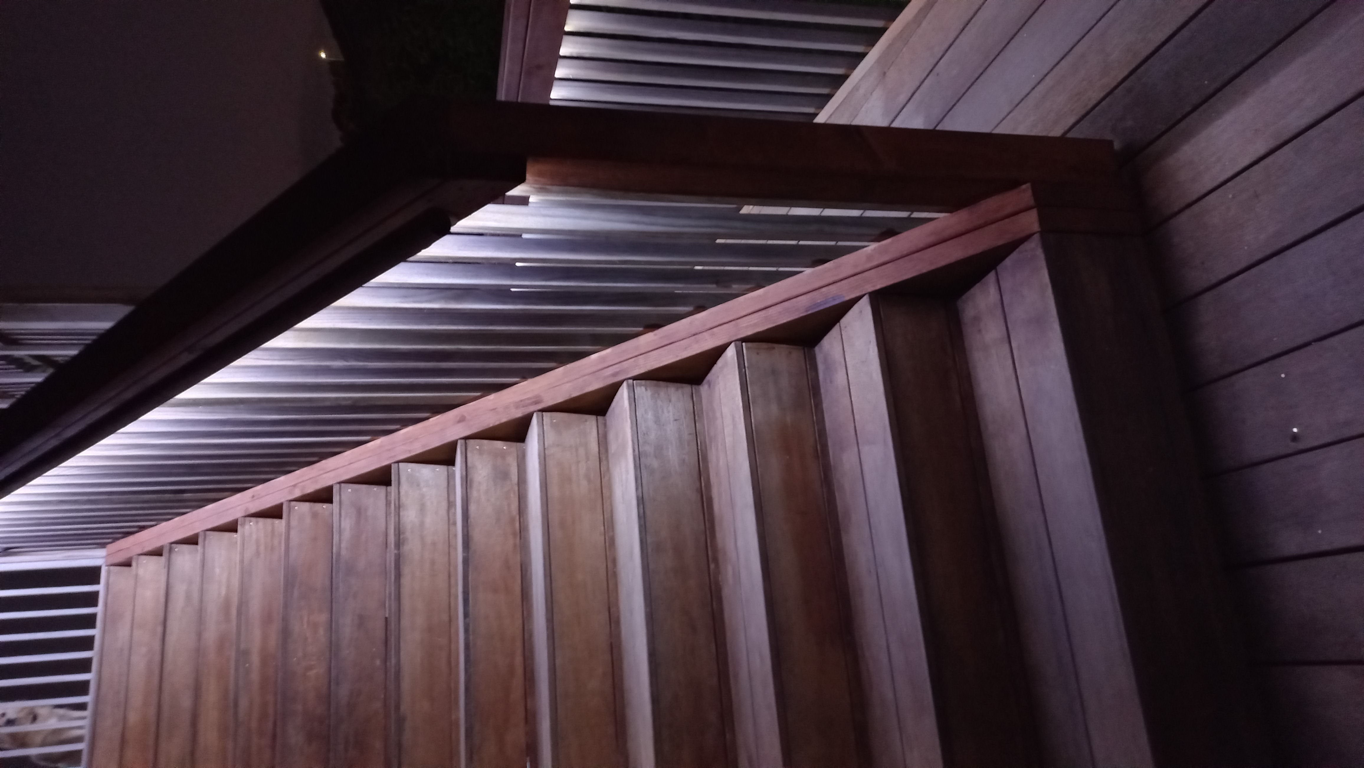 Beautifully lit garden path and outdoor patio area at dusk